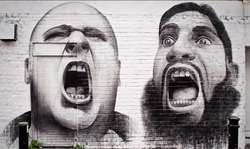 Gritos. Graffiti pintado en una pared de la calle Hanbury Street, off Brick Lane.